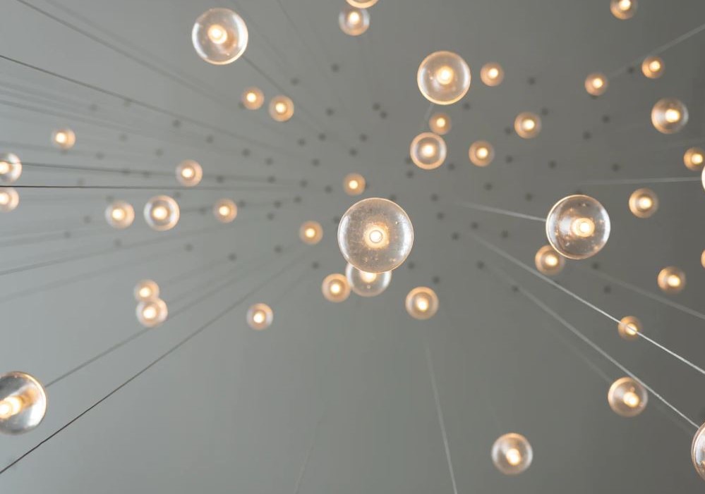 light bulbs dangling from ceiling representing new ideas